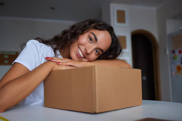 happy-woman-unpacking-container-home-